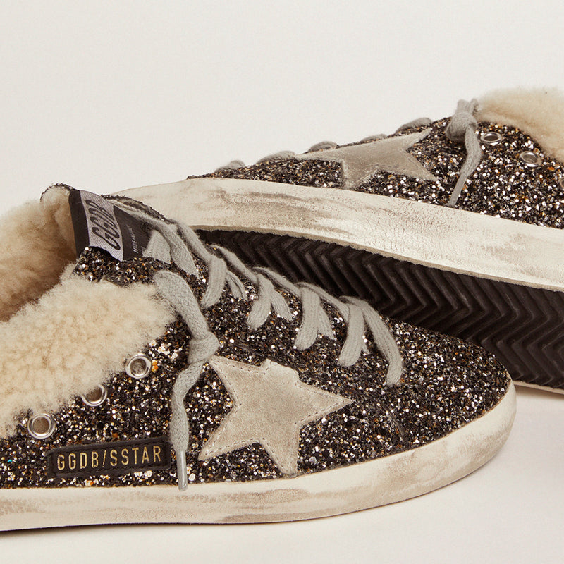 GOLDEN GOOSE SUPER STAR SABOT SNEAKERS IN BLACK & GOLD WITH SHEARLING LINING
